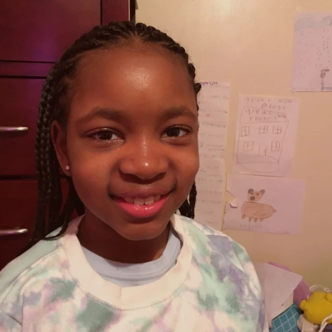 Bella smiling with braids, 2023