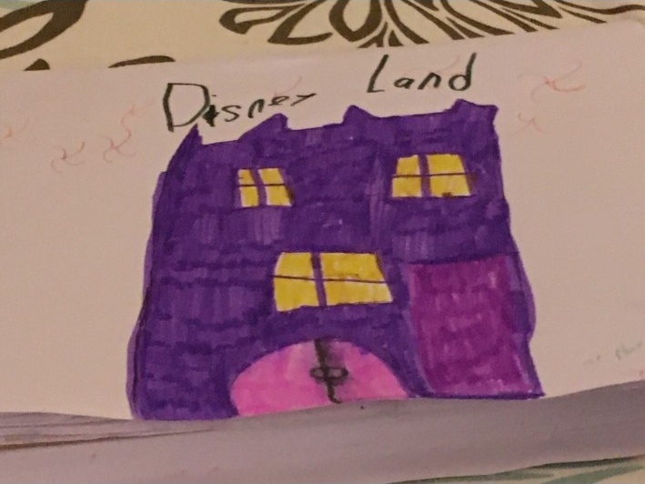 Bella’s drawing labeled “Disney Land.”