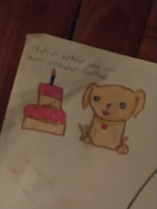 Bella made this puppy-and-cake drawing to wish Stuffuls a happy birthday on her dog’s birthday.